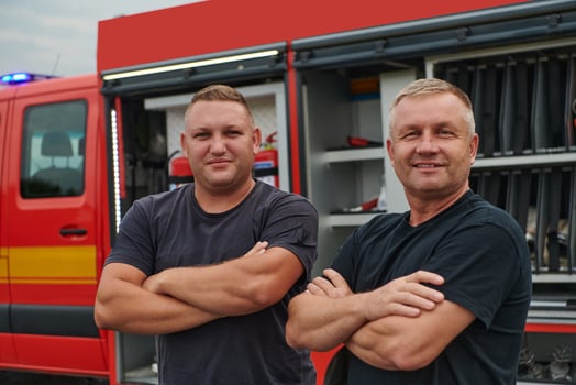 A skilled and dedicated professional firefighting team proudly poses in front of their state of the art firetruck, showcasing their modern equipment and commitment to ensuring public safety. photo