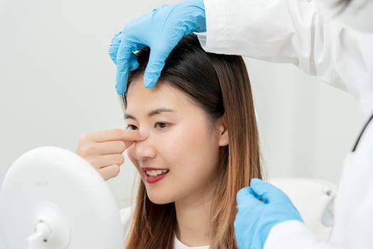 plastic surgery, beauty, Surgeon or beautician touching woman face, surgical procedure that involve altering shape of nose, doctor examines patient nose before rhinoplasty, medical assistance, health photo