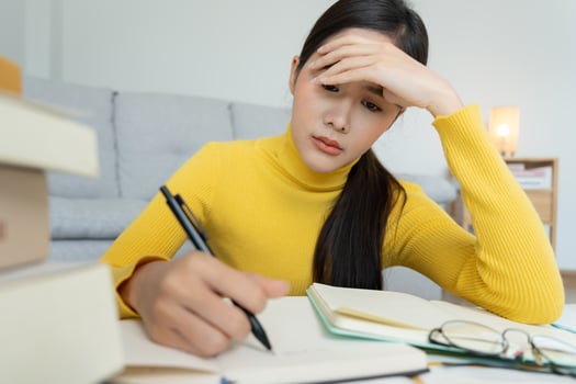 Asian student woman have anxiety because of exams, female prepare for test and learning lessons in the library. stress, despair, haste, misunderstanding reading, discouraged, expectation, knowledge photo