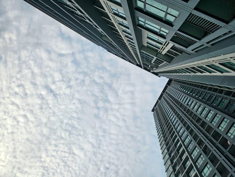 Low angle view of sky and cloud with modern office building or apartment photo