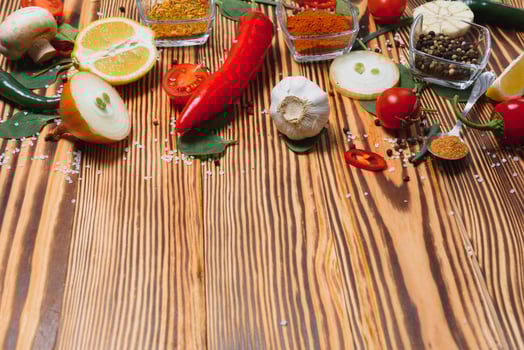 Spices and herbs over wooden background, healthy or cooking concept photo