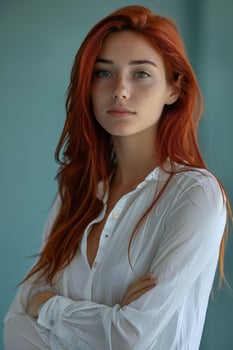Portrait of a Young Woman With Long Red Hair Wearing a White Shirt photo