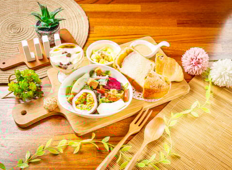 Vegetable and Fruit Salad with dragon fruit, passion fruit, cabbage, lettuce and tomato, Lemon Cake and Tofu Pudding served in dish isolated on wooden table side view of taiwan food photo