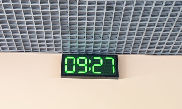 Digital clock in airport terminal. photo