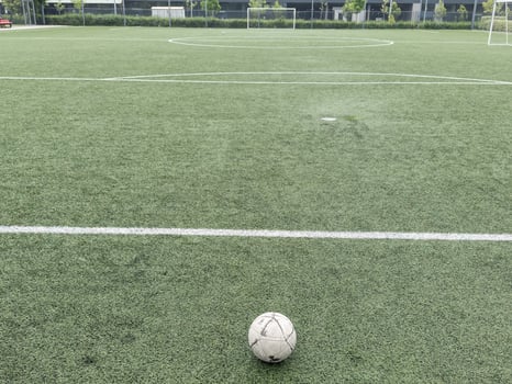 old football on Artificial turf football field green photo