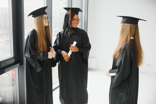 group of multiracial university graduates at graduation ceremony photo