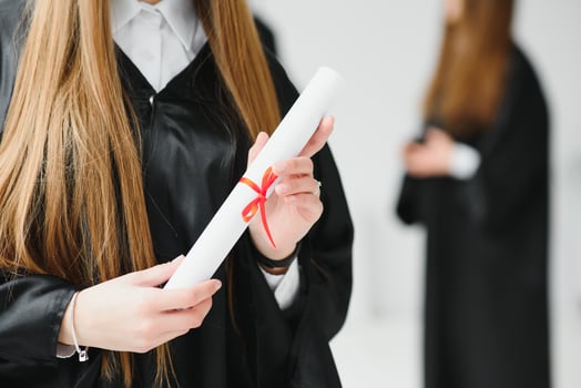 portrait of multiracial graduates holding diploma photo