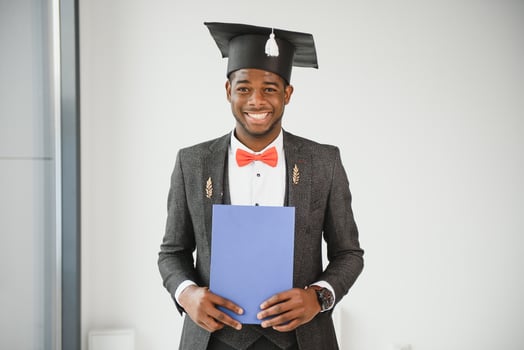African American graduate holding diploma. photo