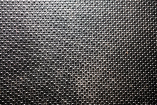 Textured black surface with circular bumps photo