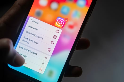 Instamatic app icon with context menu on smart phone screen photo