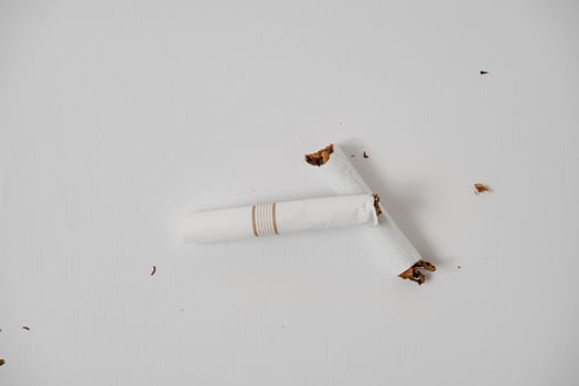a broken cigarette on a white background photo