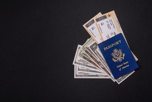 United States of America passport, airline tickets and money photo