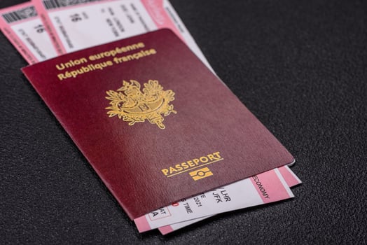 Passport of the Republic of France, airline tickets and money photo
