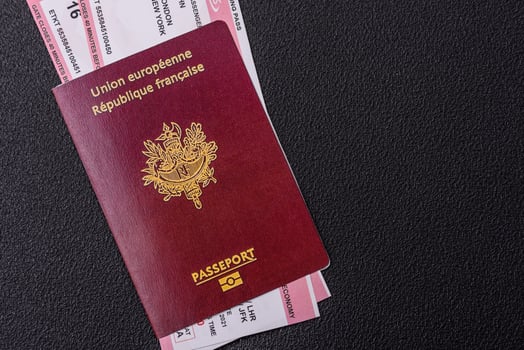 Passport of the Republic of France, airline tickets and money photo