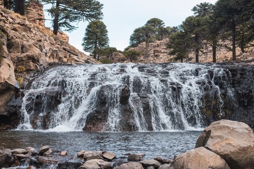 splendid waterfall between the mountains photo