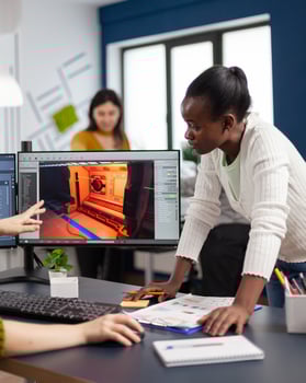 Mixed races of game creators testing the interface of videogame, analysing software problems. Diverse team developing project sitting in startup creative agency company using pc with two monitors photo