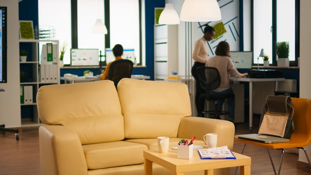 Diverse business people working in modern start up office discussing financial strategy. Multiethnic coworkers talking about startup annual reports of company in modern business office photo