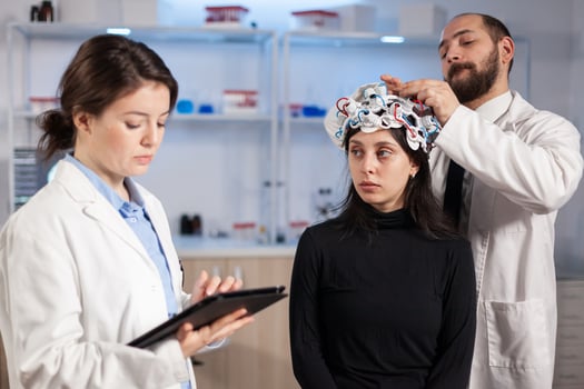 Team neurological doctors working together developing treatment for diagnosis of disease, explaning eeg results, health status, brain functions, nervous system and tomography scan. photo