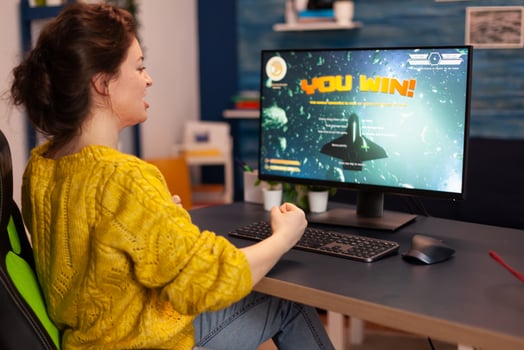 Professional gamer playing and winning in space shooter online game on powerful computer. Pro esports player streaming cyber performing gaming tournament in cyberspace using network wireless. photo