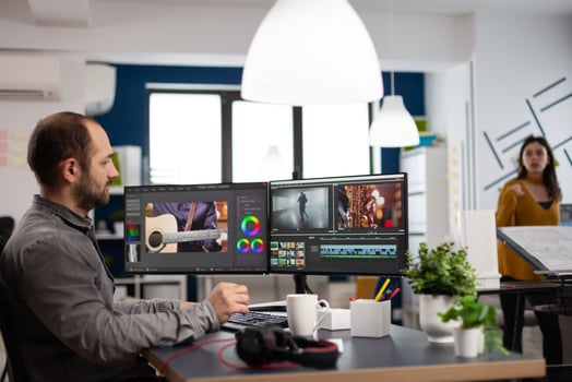 editor man editing movie project working in start up creativity multimedia agency office sitting at pc with two monitors. Editor processing film montage using post production software photo