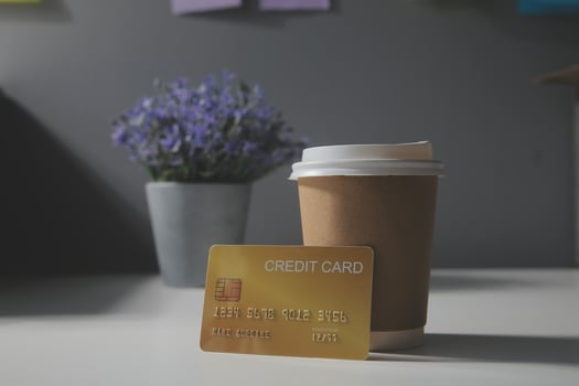 close up on calculator with group of mail letter and credit card at white table for end of the month expense day concept photo
