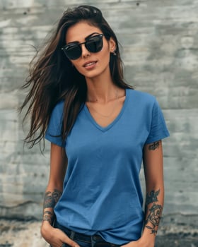 A Latin woman poses confidently in a blue v-neck t-shirt photo