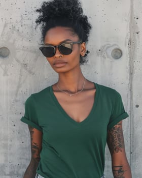 A woman wearing a green V-neck t-shirt and sunglasses photo