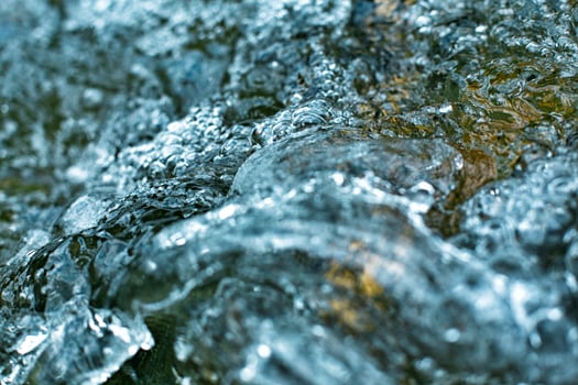 river boiling water with bubbles close, water in the nature photo