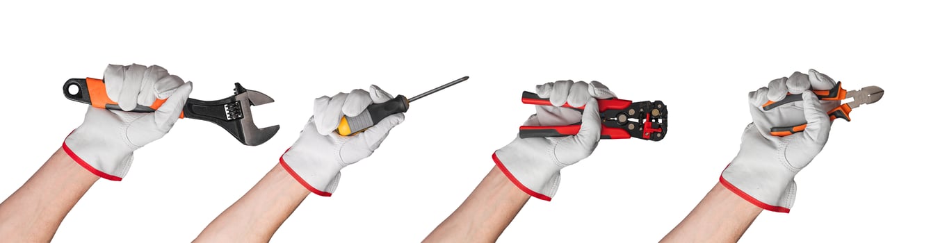 Hand tools for construction and repair work. Includes wrenches, screwdrivers, and pliers. Isolated photo