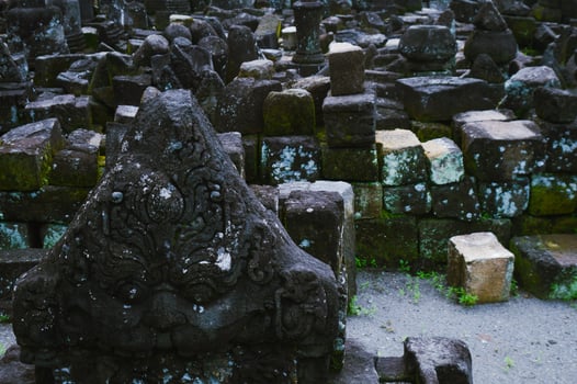 Piles of Buddhist relics around Mendut temple photo