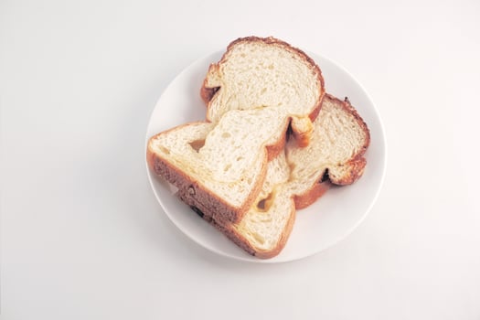 Fresh bread on a coaster plate in a white background photo