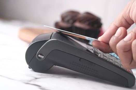 Payment terminal charging from a credit card , close up photo