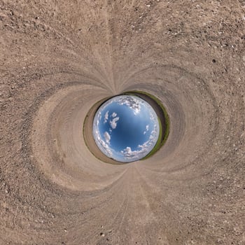 blue hole sphere or globe little planet inside sand or dry grass round frame background photo