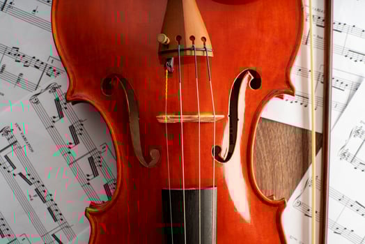 Violin body and archer with undefined musical score photo