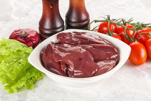 Raw turkey liver in a bowl ready for cooking photo