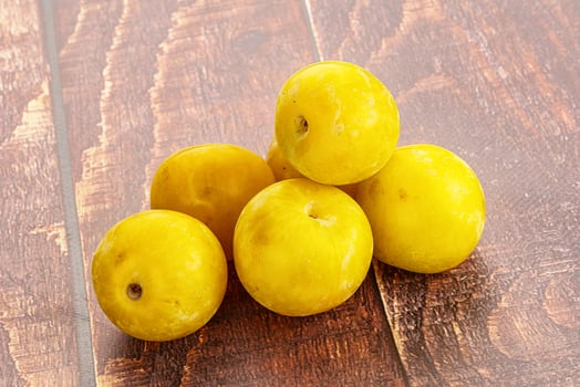 Yellow sweet plum heap fruit photo