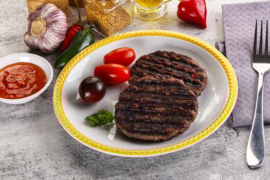 Grilled burger cutlet with sauce photo