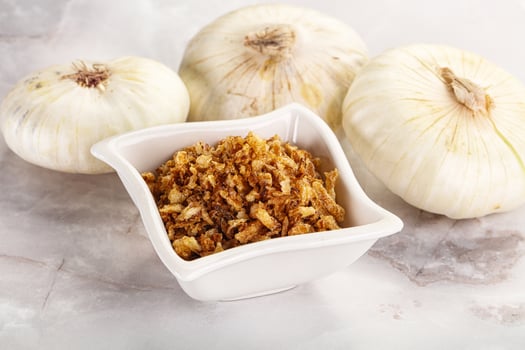 Dried roasted onion flakes for culinary photo
