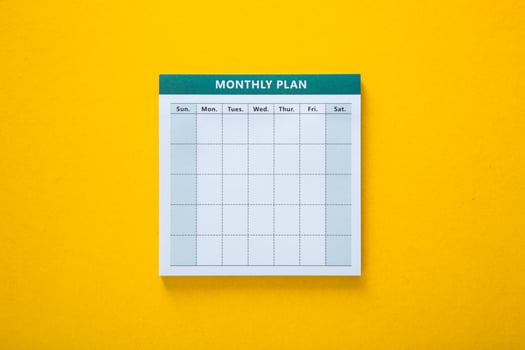 Colorful monthly planner with yellow background photo