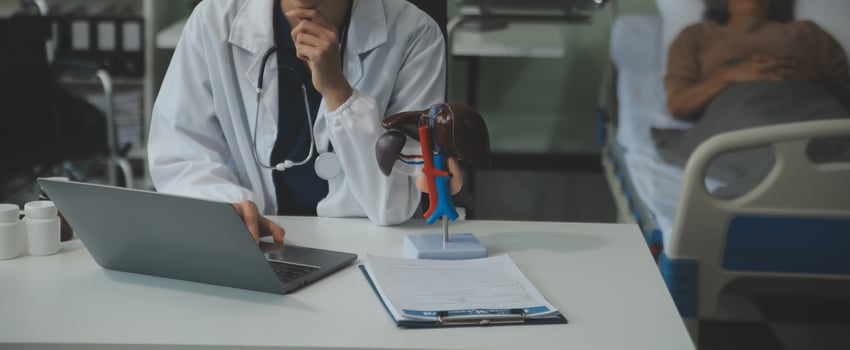 Female doctor explaining to patient results of model the process of patients. Diagnosis of diseases for Model Internal organ. photo