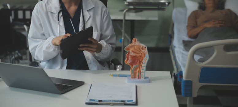 Female doctor explaining to patient results of model the process of patients. Diagnosis of diseases for Model Internal organ. photo