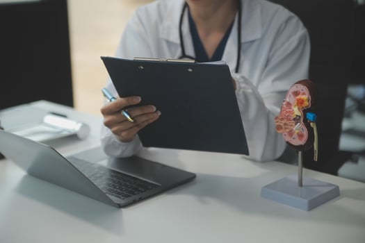 Female doctor explaining to patient results of model the process of patients. Diagnosis of diseases for Model Internal organ. photo