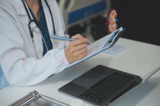 Female doctor explaining to patient results of model the process of patients. Diagnosis of diseases for Model Internal organ. photo