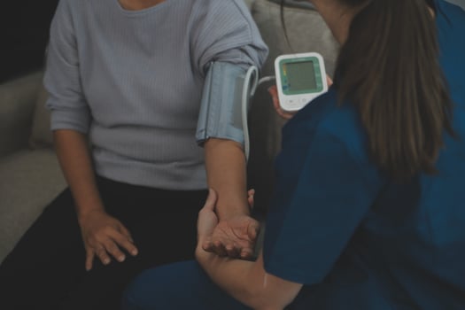 Doctor doing professional pressure examine her young patient photo