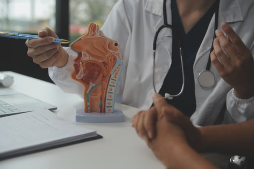 Female doctor explaining to patient results of model the process of patients. Diagnosis of diseases for Model Internal organ. photo