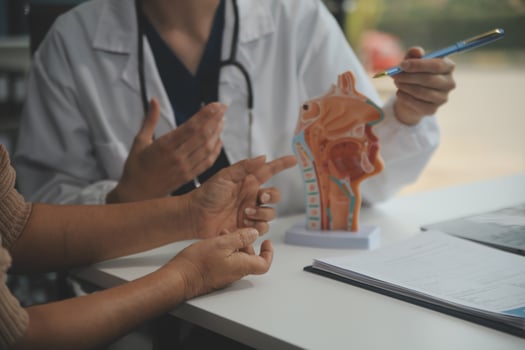 Female doctor explaining to patient results of model the process of patients. Diagnosis of diseases for Model Internal organ. photo