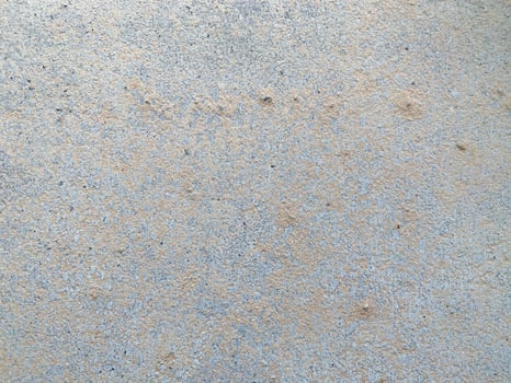 A white wall with a hole in it. The wall is cracked and has a rough texture photo