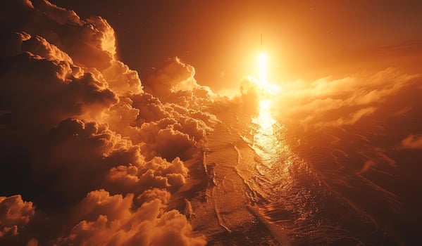 The sky is filled with clouds and the water is calm photo