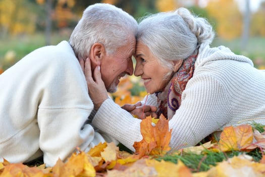 Loving mature couple in the park in summer photo