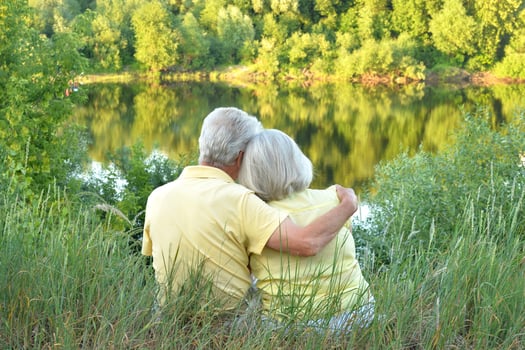 Loving mature couple in the park in summer photo